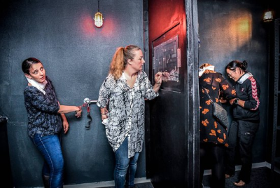 Group of ladies finding a way to get escape from the room